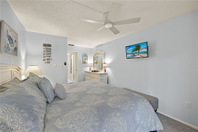 bedroom featuring carpet flooring, ceiling fan, and a textured ceiling