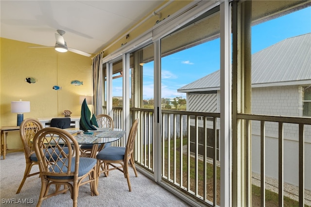 sunroom featuring ceiling fan