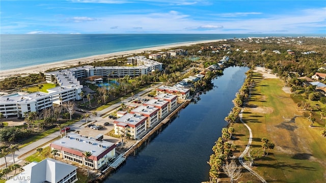 aerial view featuring a view of the beach and a water view