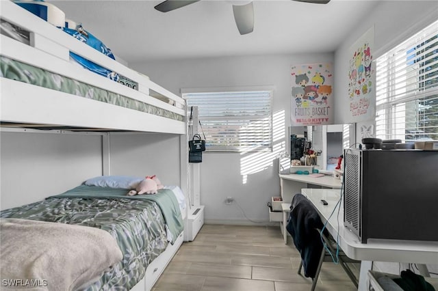 bedroom featuring light hardwood / wood-style flooring and ceiling fan