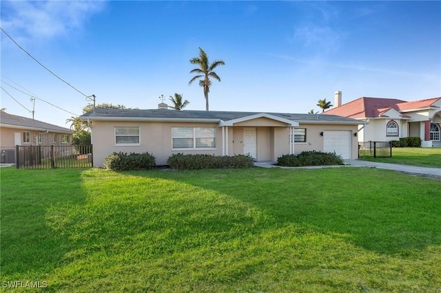 ranch-style house featuring a garage and a front lawn