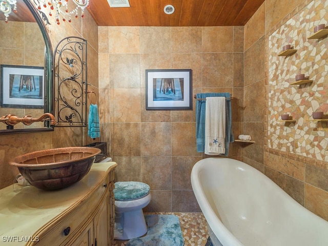 bathroom featuring vanity, tile walls, wooden ceiling, toilet, and a bathing tub