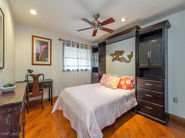 bedroom featuring hardwood / wood-style floors and ceiling fan