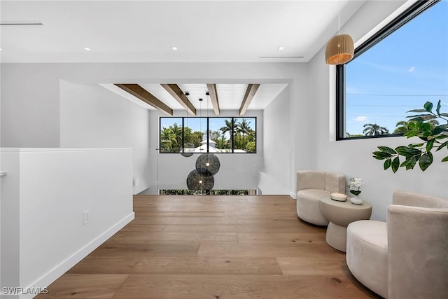788 7th Ave N, Naples, FL 34102 - living area featuring wood finished floors and beam ceiling