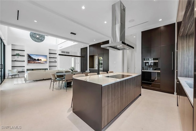 kitchen with visible vents, island exhaust hood, a large island, and modern cabinets