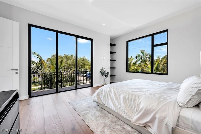 bedroom featuring recessed lighting, light wood-type flooring, access to exterior, and baseboards