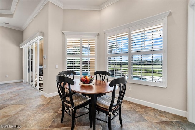 dining room featuring ornamental molding