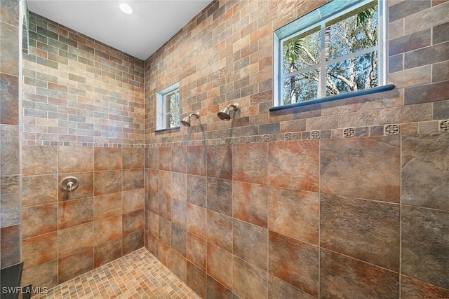 bathroom featuring tiled shower