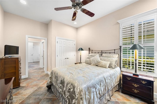 bedroom with ceiling fan and a closet