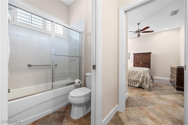 bathroom featuring shower / bath combination with glass door, toilet, and ceiling fan