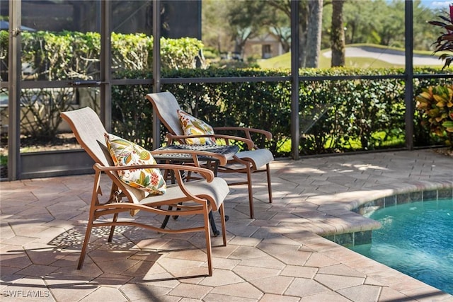 sunroom / solarium featuring a pool