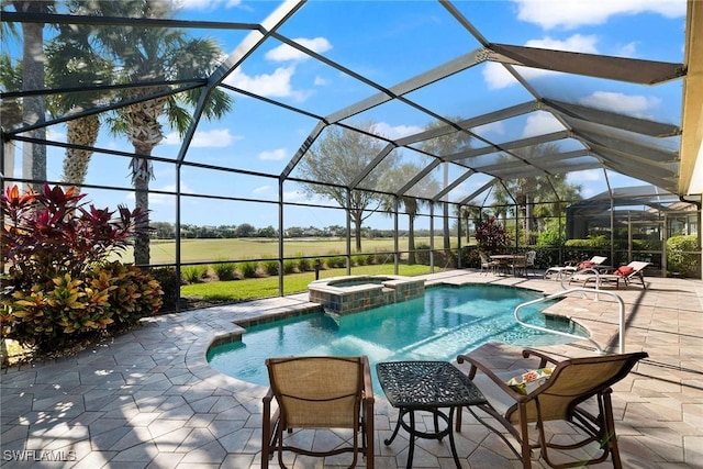 view of pool featuring an in ground hot tub, glass enclosure, and a patio area