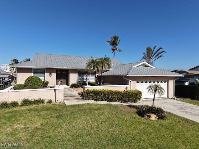 ranch-style home with a garage and a front yard