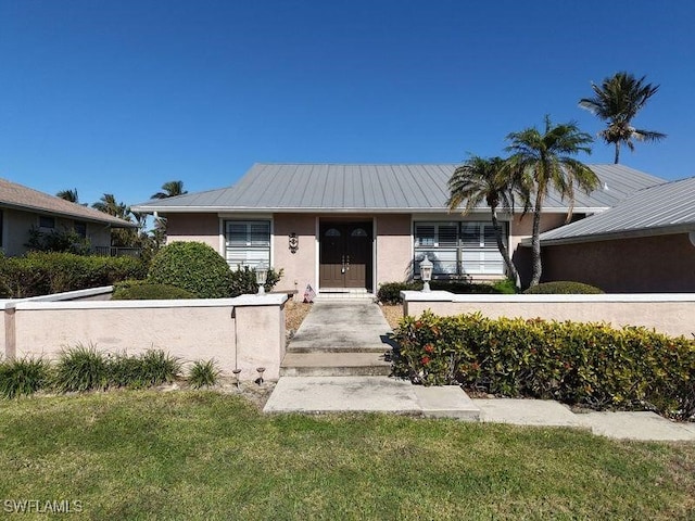 view of front of home with a front lawn