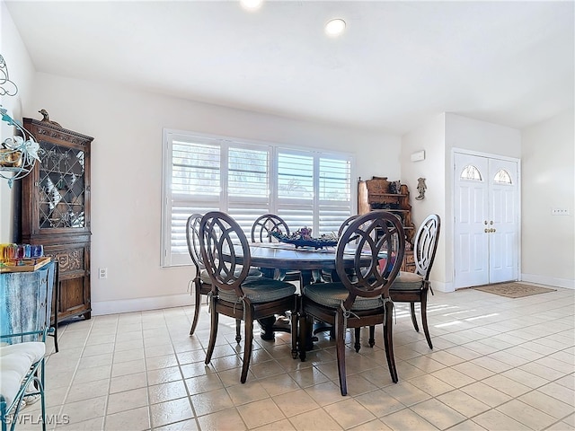 dining area featuring light tile patterned floors