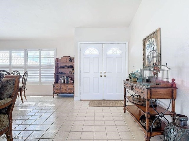 foyer featuring light tile patterned flooring