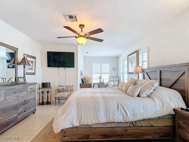 bedroom featuring ceiling fan and light tile patterned flooring