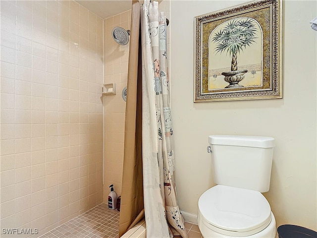 bathroom with toilet and curtained shower