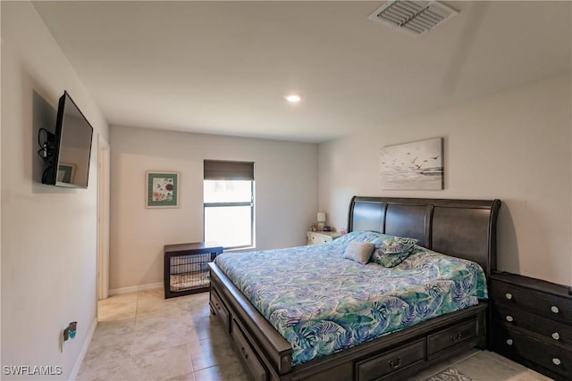 bedroom with light tile patterned floors