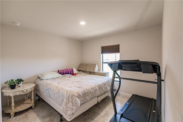 bedroom with light tile patterned flooring