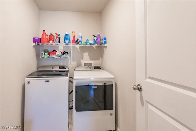 washroom with washing machine and dryer