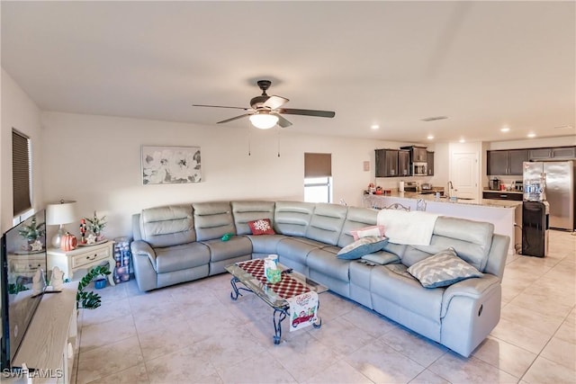 living room featuring ceiling fan and light tile patterned flooring