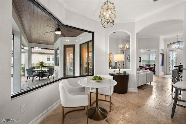 dining area with ceiling fan, crown molding, and a healthy amount of sunlight