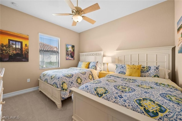 bedroom with ceiling fan and light colored carpet