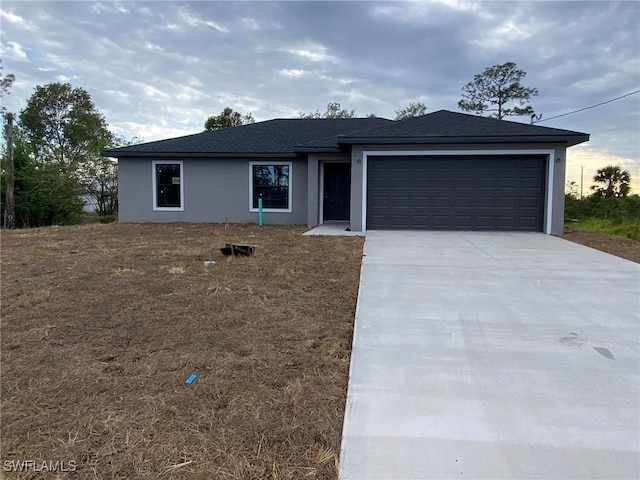 ranch-style home with a garage