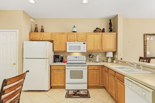 kitchen featuring light tile patterned floors, white appliances, light brown cabinetry, and sink