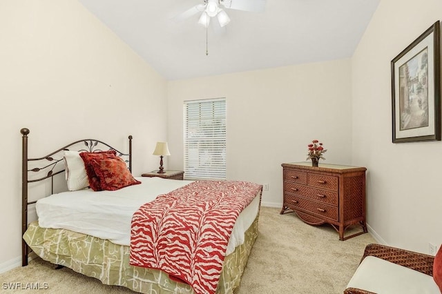 carpeted bedroom with ceiling fan and lofted ceiling