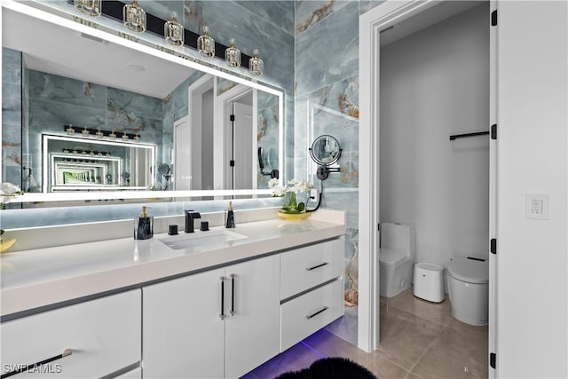 bathroom featuring tile patterned floors, vanity, and toilet