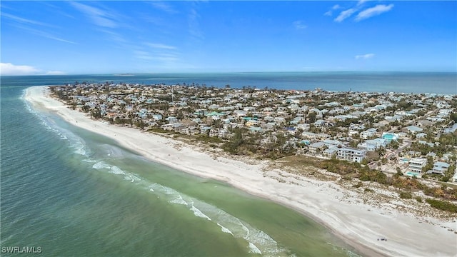 bird's eye view featuring a water view and a beach view