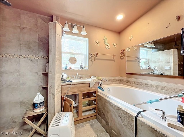 bathroom with tile patterned flooring, shower with separate bathtub, and vanity