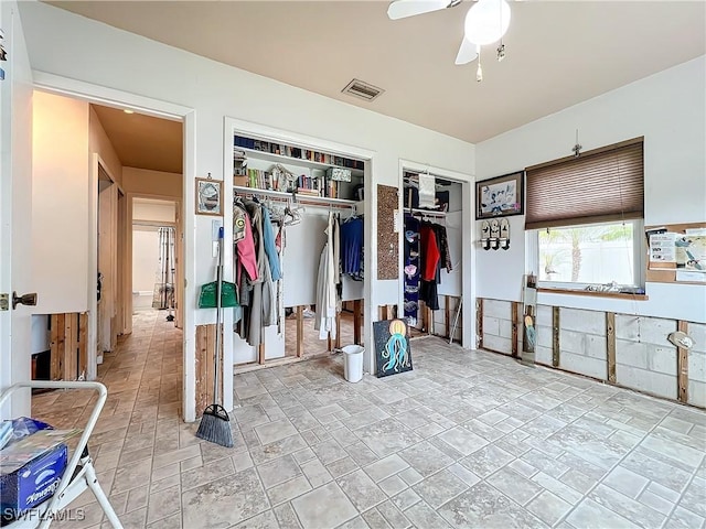 interior space featuring ceiling fan