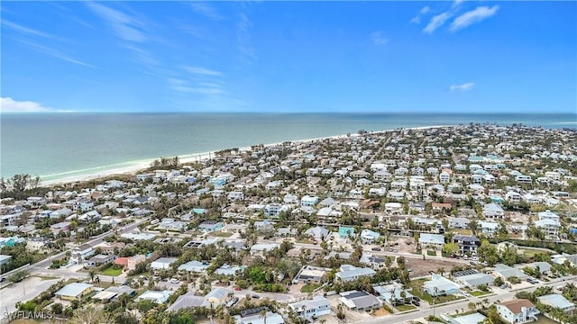 bird's eye view with a view of the beach and a water view