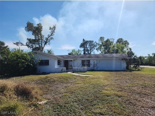 ranch-style home with a front lawn