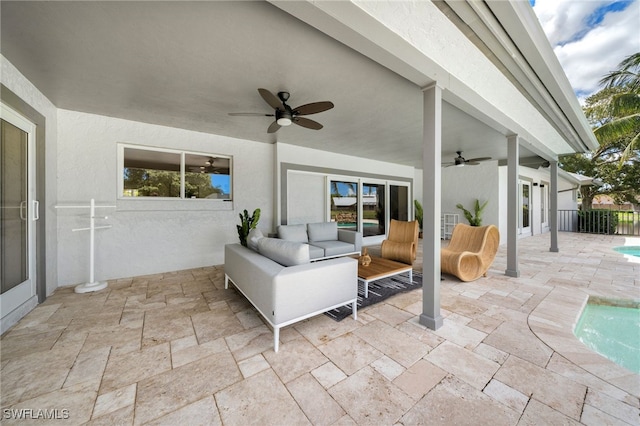 view of patio / terrace with ceiling fan and an outdoor living space