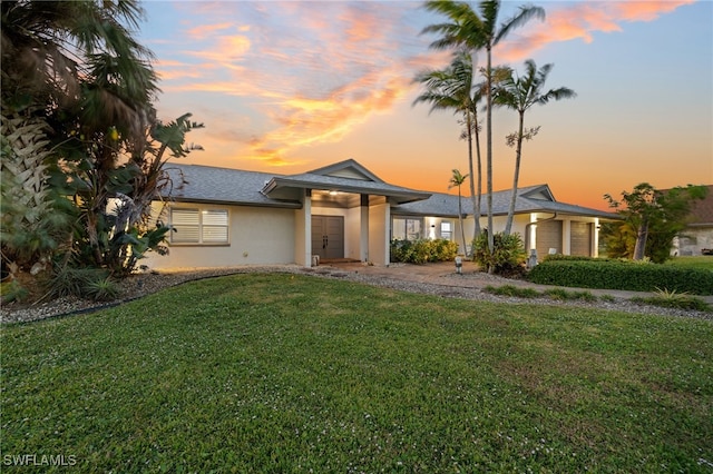 view of front of house featuring a lawn