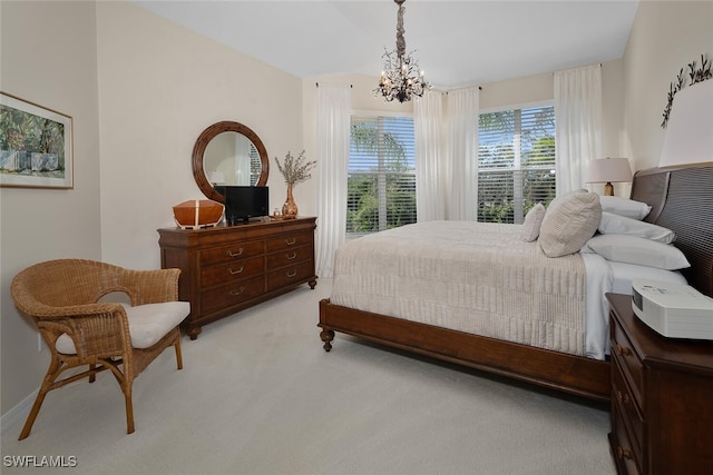 carpeted bedroom featuring a chandelier