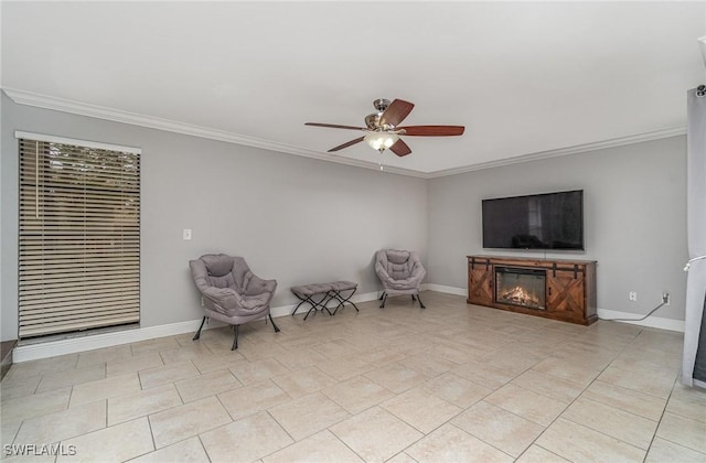 sitting room featuring ceiling fan, light tile patterned flooring, and ornamental molding