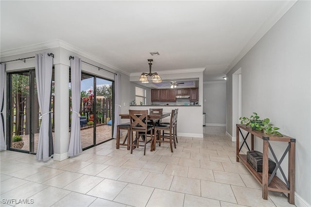 tiled dining room featuring crown molding and ceiling fan with notable chandelier