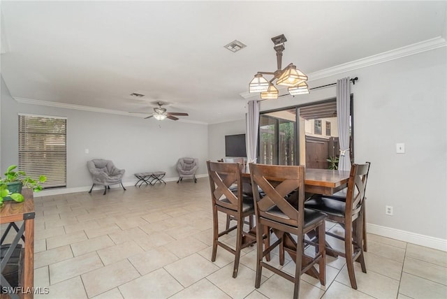 dining area with ceiling fan, ornamental molding, and light tile patterned floors