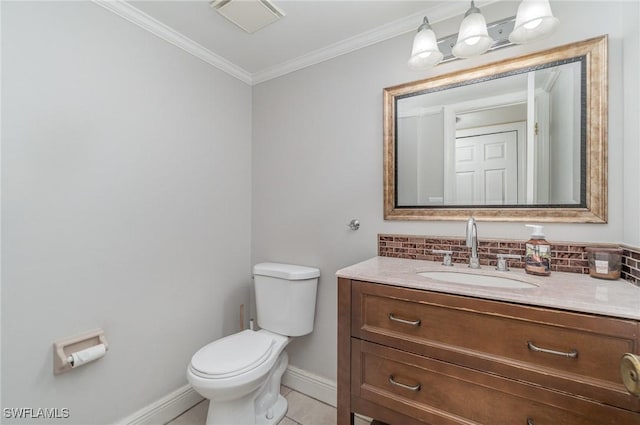 bathroom with vanity, tile patterned floors, crown molding, decorative backsplash, and toilet