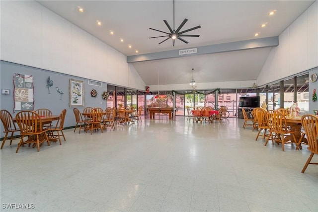 dining space featuring high vaulted ceiling and ceiling fan