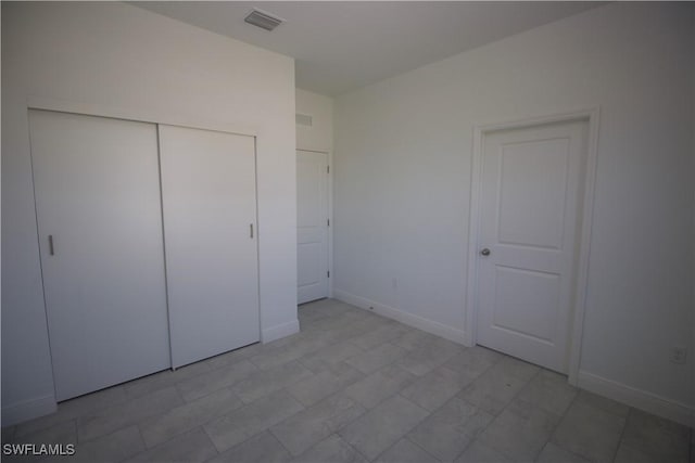 unfurnished bedroom with a closet