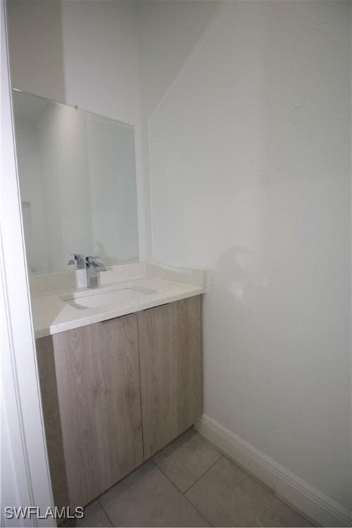 bathroom featuring tile patterned floors and vanity