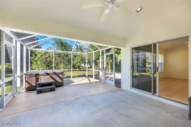 unfurnished sunroom with vaulted ceiling and ceiling fan