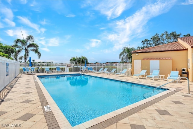 view of pool featuring a patio