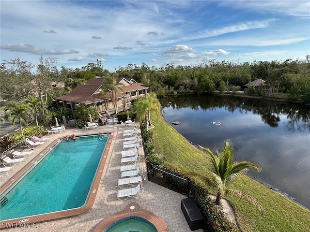 view of swimming pool with a water view